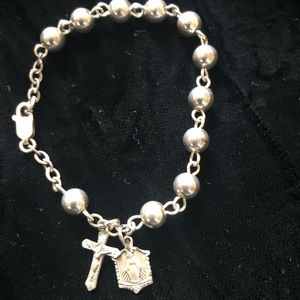 Child’s Sterling silver bracelet with Cross & Med.
